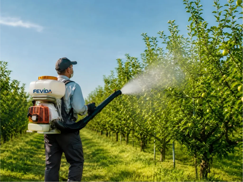 Backpack mist duster used for orchard spraying and crop protection in fruit trees